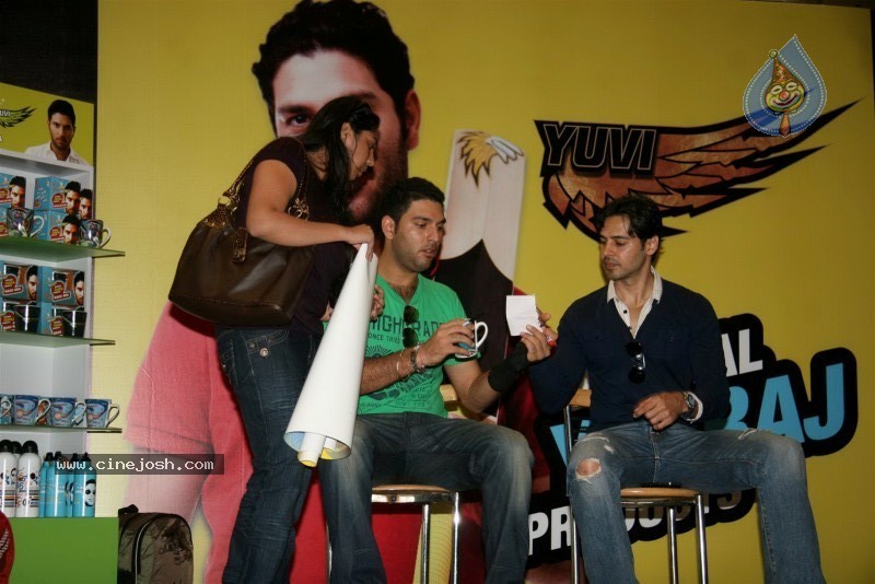 Yuvraj Singh showcasing products at the launch - 5 / 15 photos