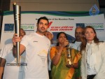 John Abraham,Maria Polyzou At Marathon Flame Run - 23 of 25