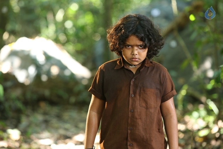 Manyam Puli Re Release Posters and Photos - 2 / 11 photos